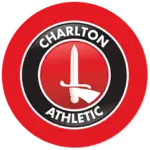 A Charlton Athletic club crest on a red circle