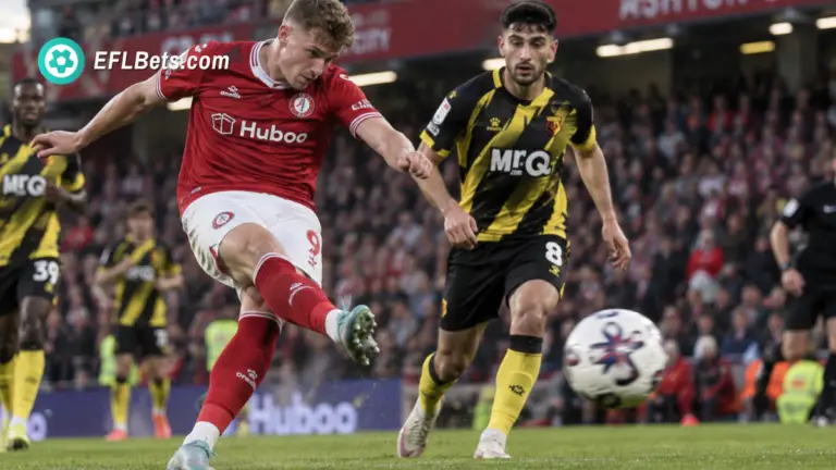 Dom Ballard of Bristol City getting a shot away as Amin Nabizada of Watford looks on