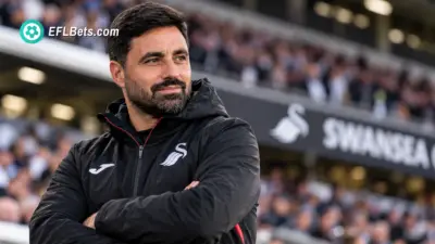Swansea City manager Vítor Matos standing pitch-side