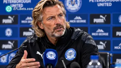 New Peterborough United manager Robbie Savage facing the press