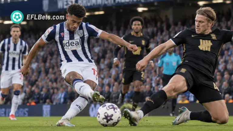 Jimmy-Jay Morgan of West Brom, getting a shot away as Christoph Klarer of Birmingham tries to block